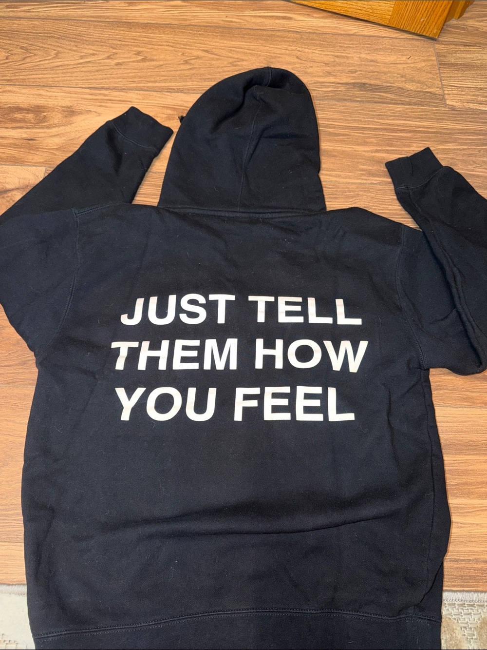 WNRS Black Hoodie with "JUST TELL THEM HOW YOU FEEL" Text